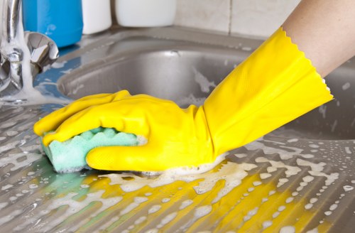 Kitchen surfaces being wiped during house cleaning