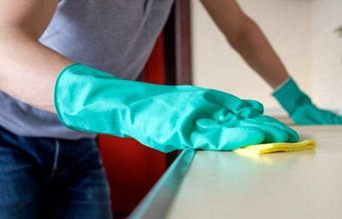 Detailed commercial window cleaning on storefront glass